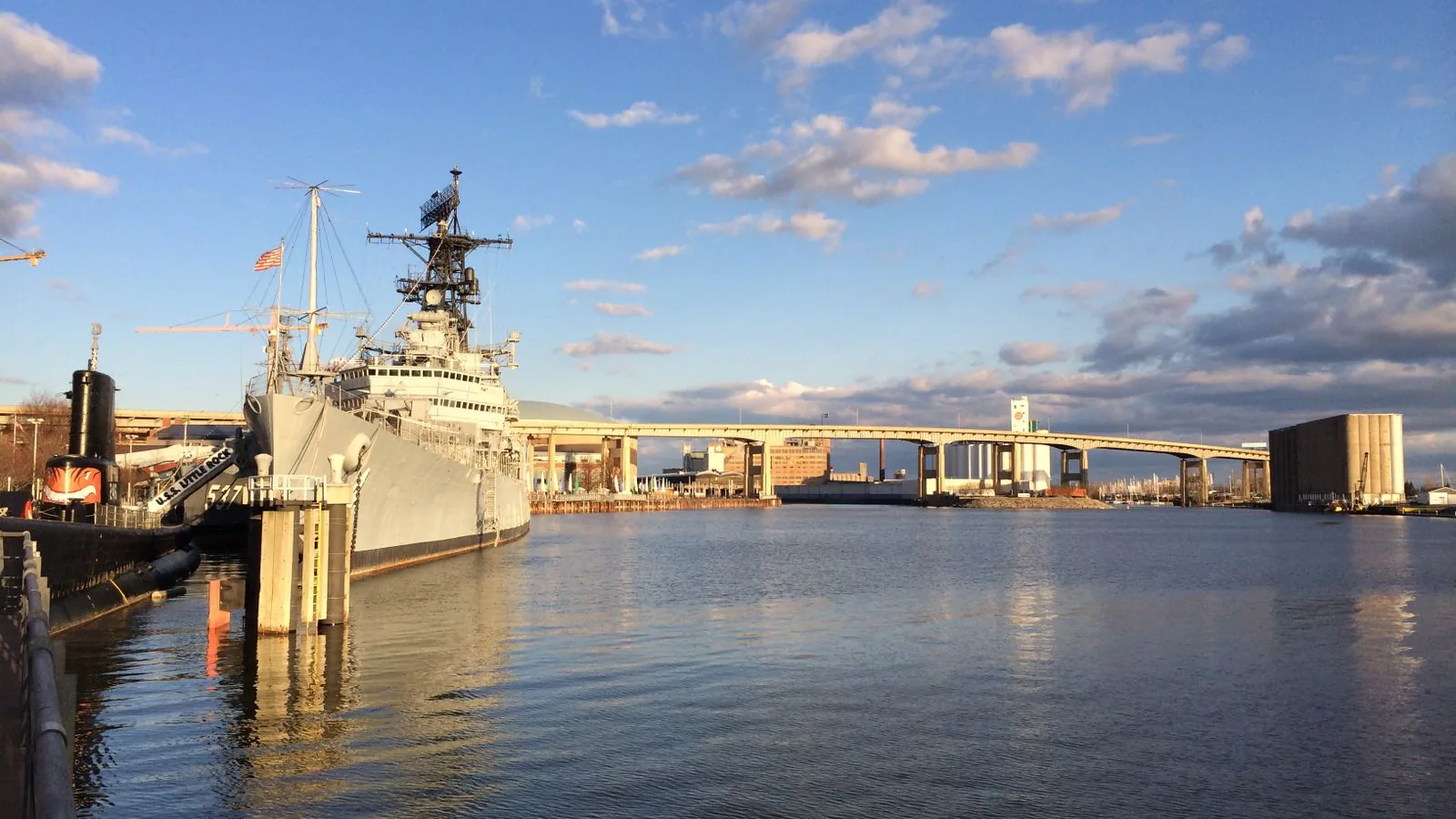 USS Little Rock docked at the Buffalo waterfront with the city bridge, daytime